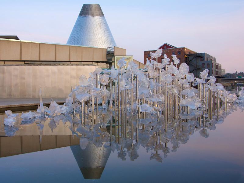 The Museum of Glass cone reflected in the sculpture pond 